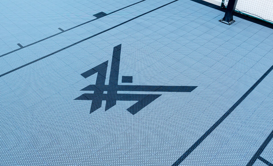 Maxx Crosby's logo on VersaCourt tiles