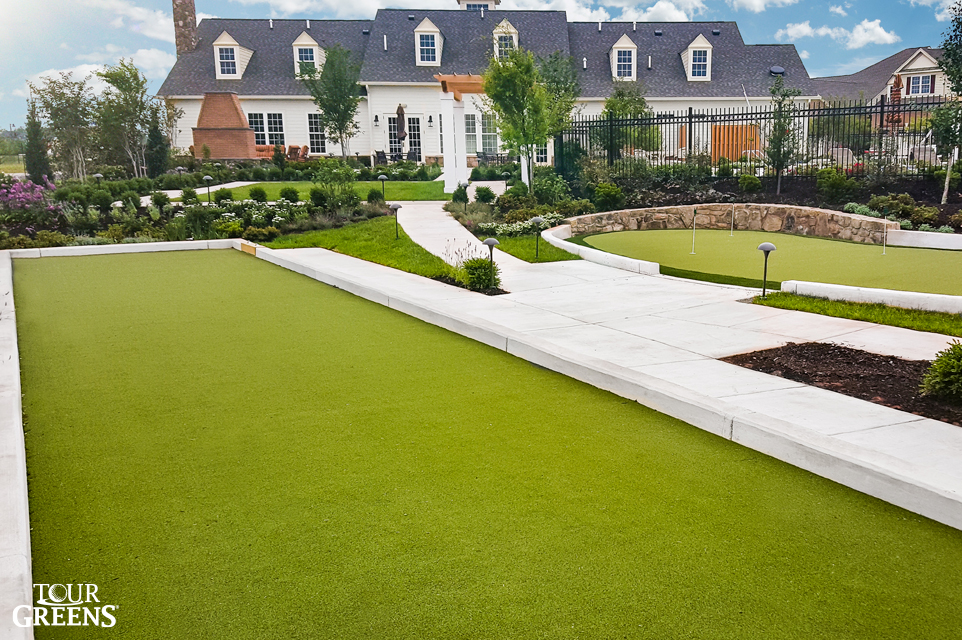 Backyard with an artificial grass bocce court
