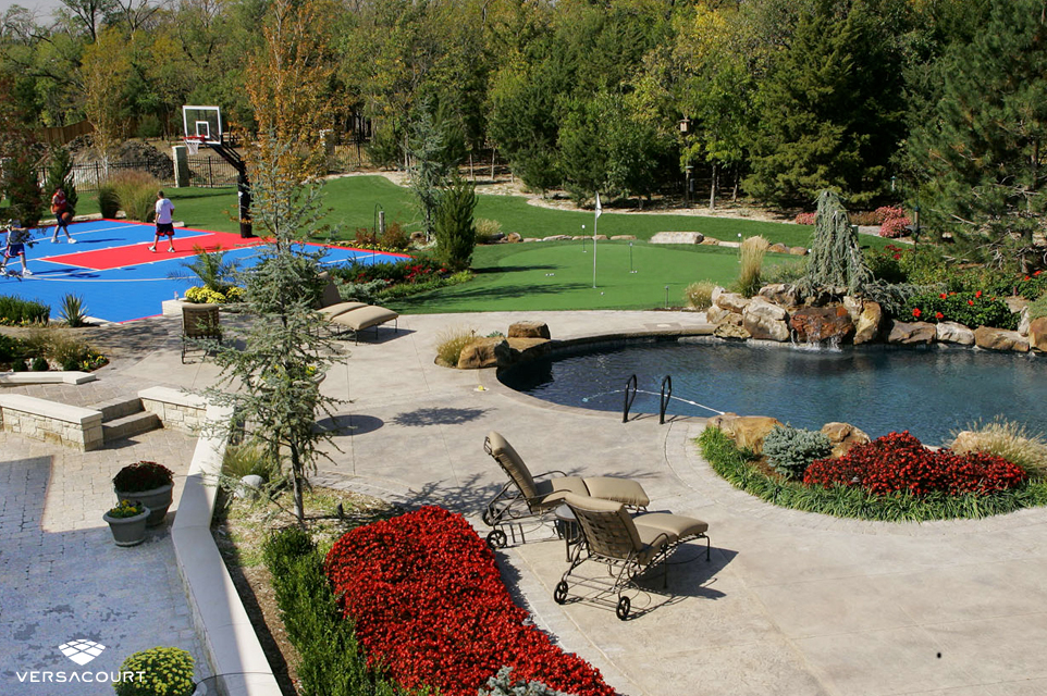 The ultimate backyard experience with a custom putting green and basketball court