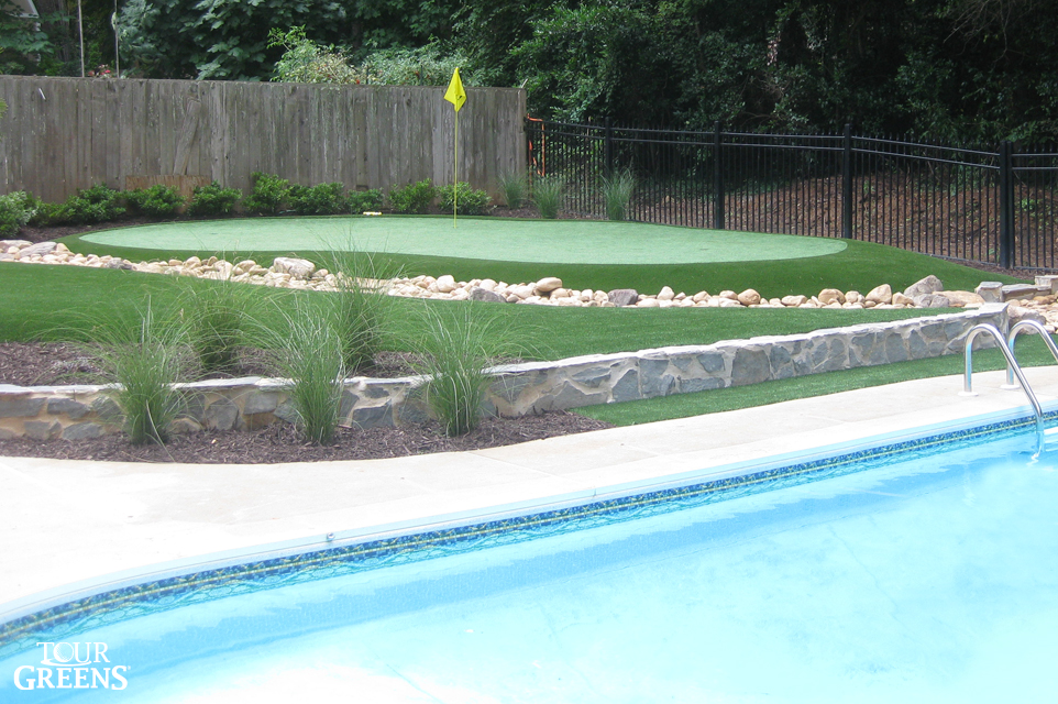 Backyard pool with a DIY putting green from XGrass installed