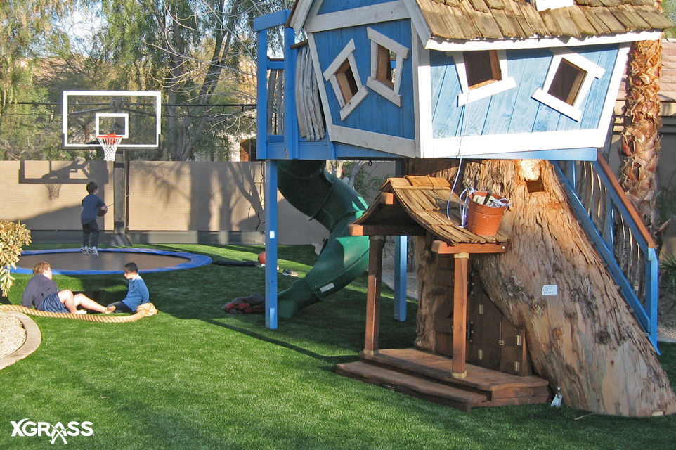 Backyard installed with IPEMA certified playground turf