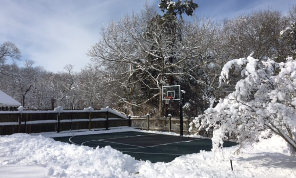 a group of people playing pickleball showcasing the pickleball court