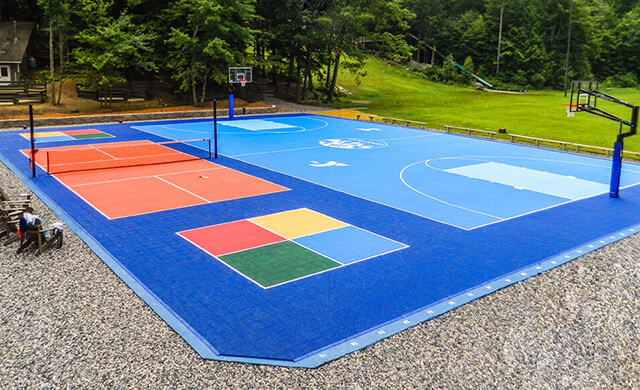 a very colorful multisport court featuring basketball and pickleball