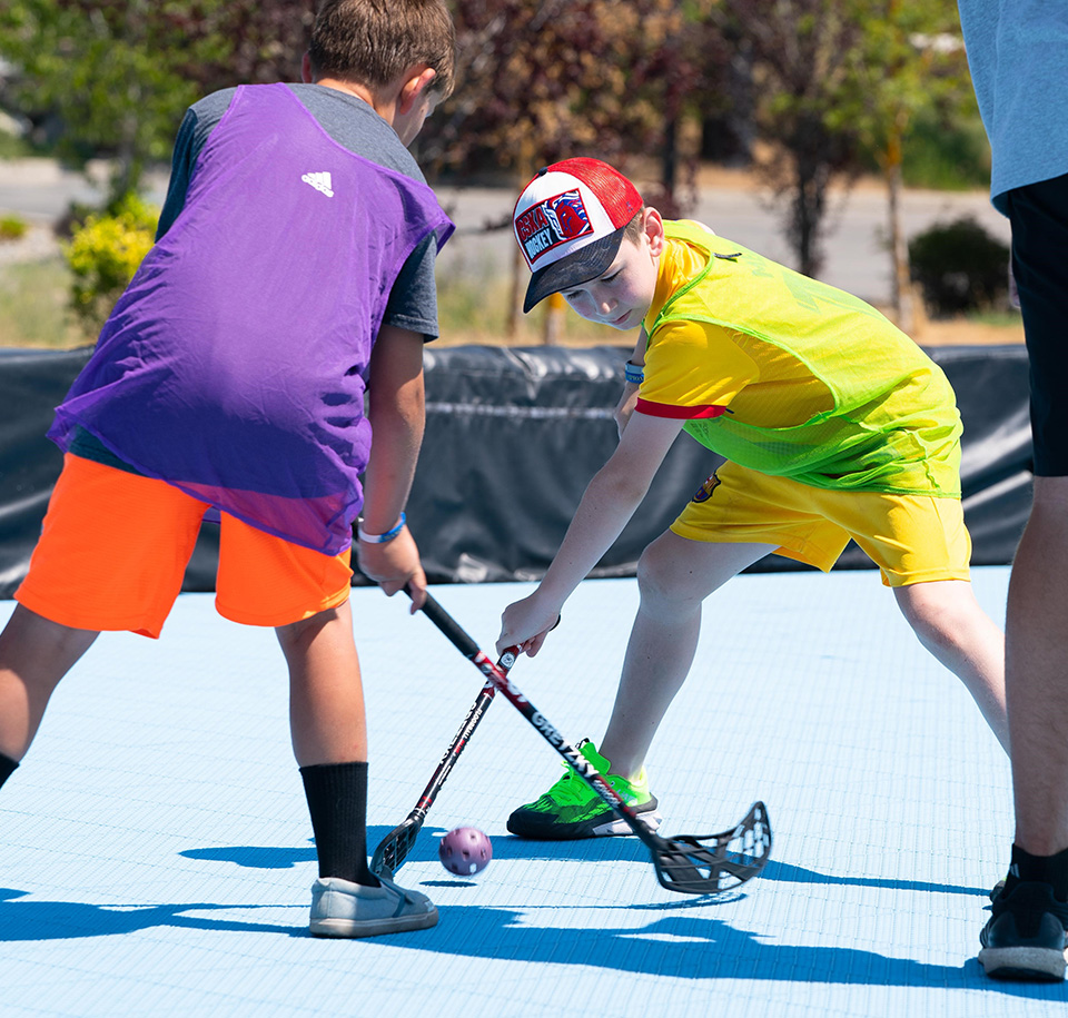 two hockey camp attendees face off at Gretzky Hockey School